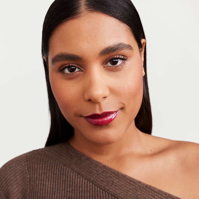 Model wearing Mary Kay fall/holiday makeup artist look Blackberry Vinyl.