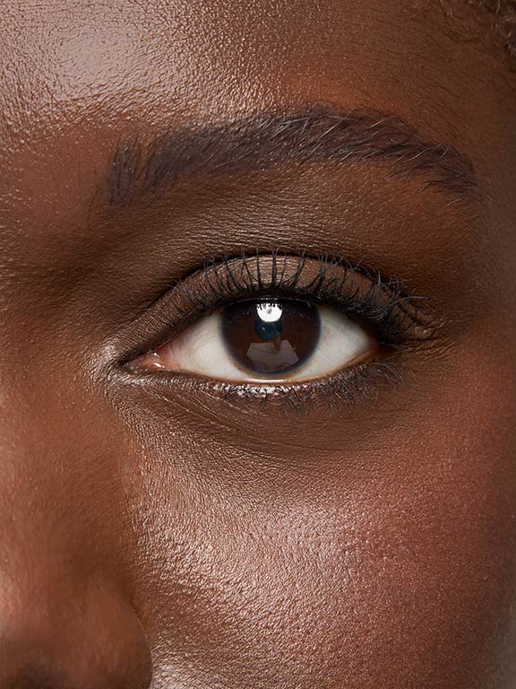 Close up shot of model with light skintone showing eyelashes after Mary Kay Great Heights Mascara application